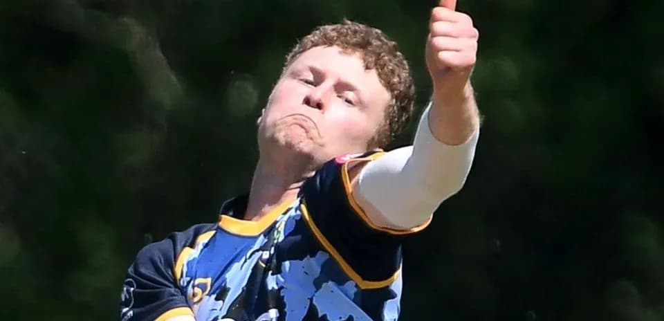 Bowler delivering a ball with thumbs up gesture