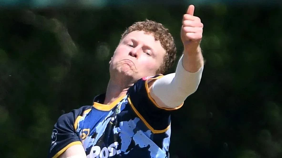 Bowler delivering a ball with thumbs up gesture