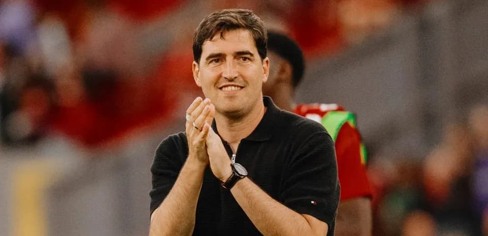 Coach applauding during a match on the sidelines