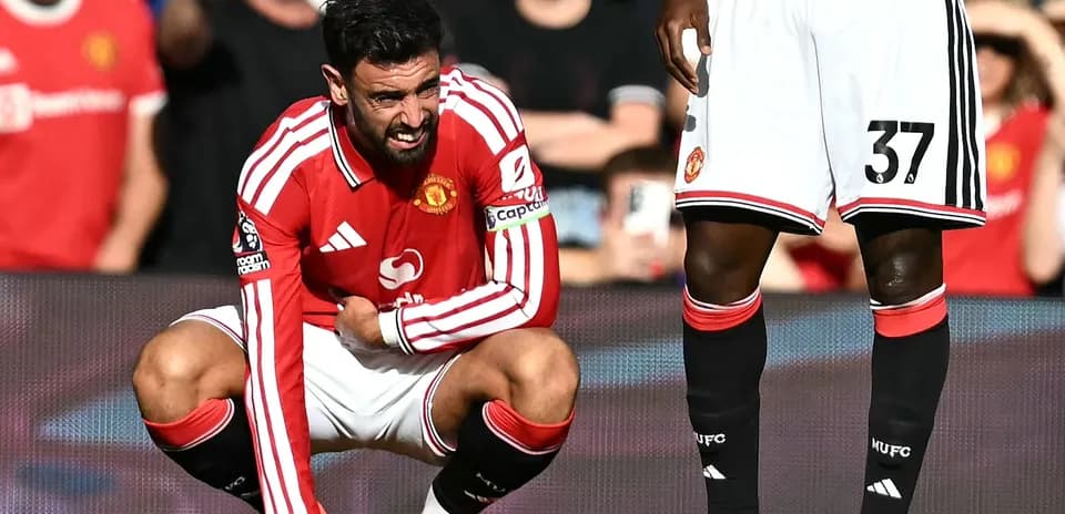 Bruno Fernandes crouching during a match injury