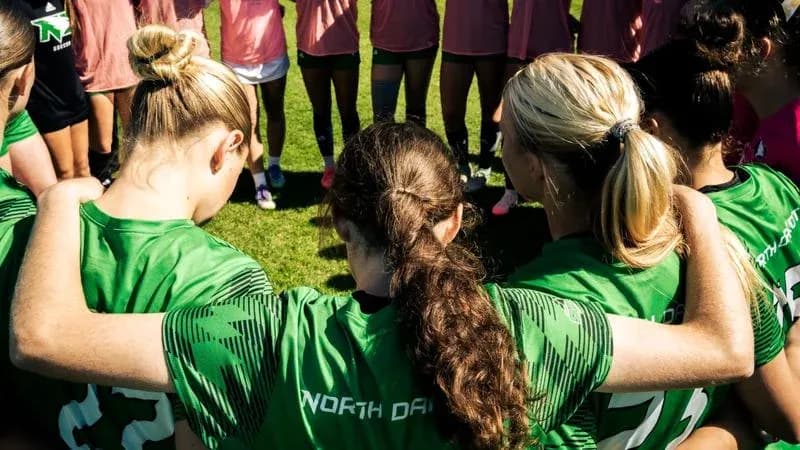 Players huddled together in team meeting