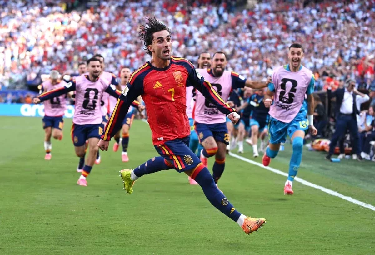 Spanish player celebrating goal with teammates in match