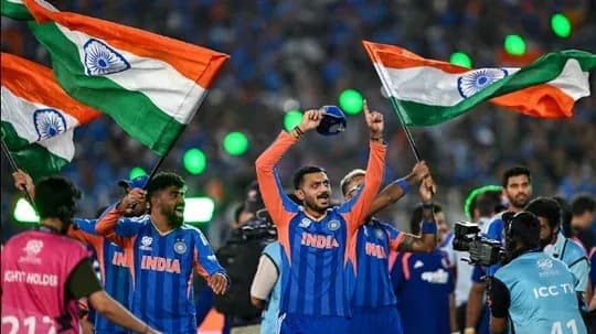 Players celebrating with Indian flags after victory