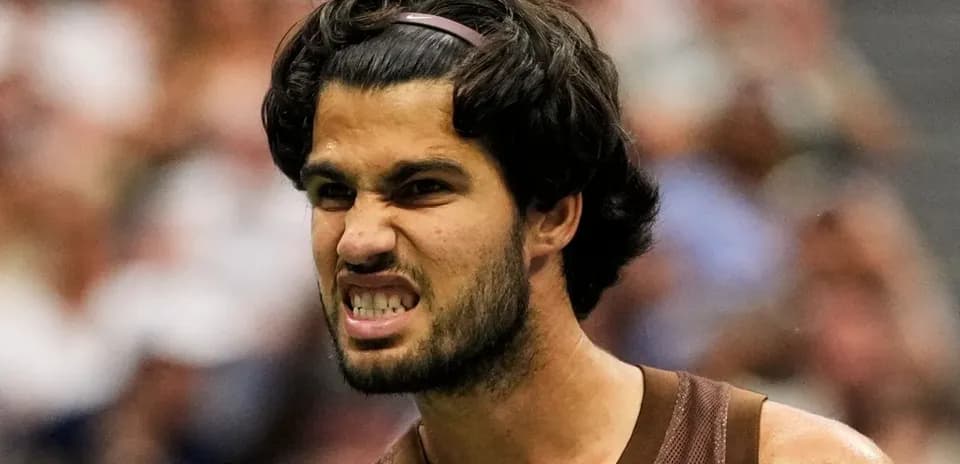 Tennis player celebrating after winning a point