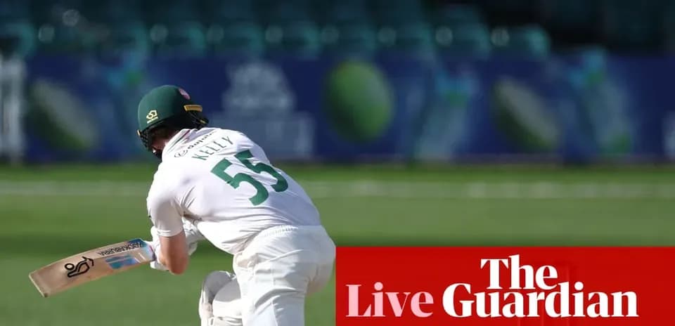 Batsman in white kit preparing to bat