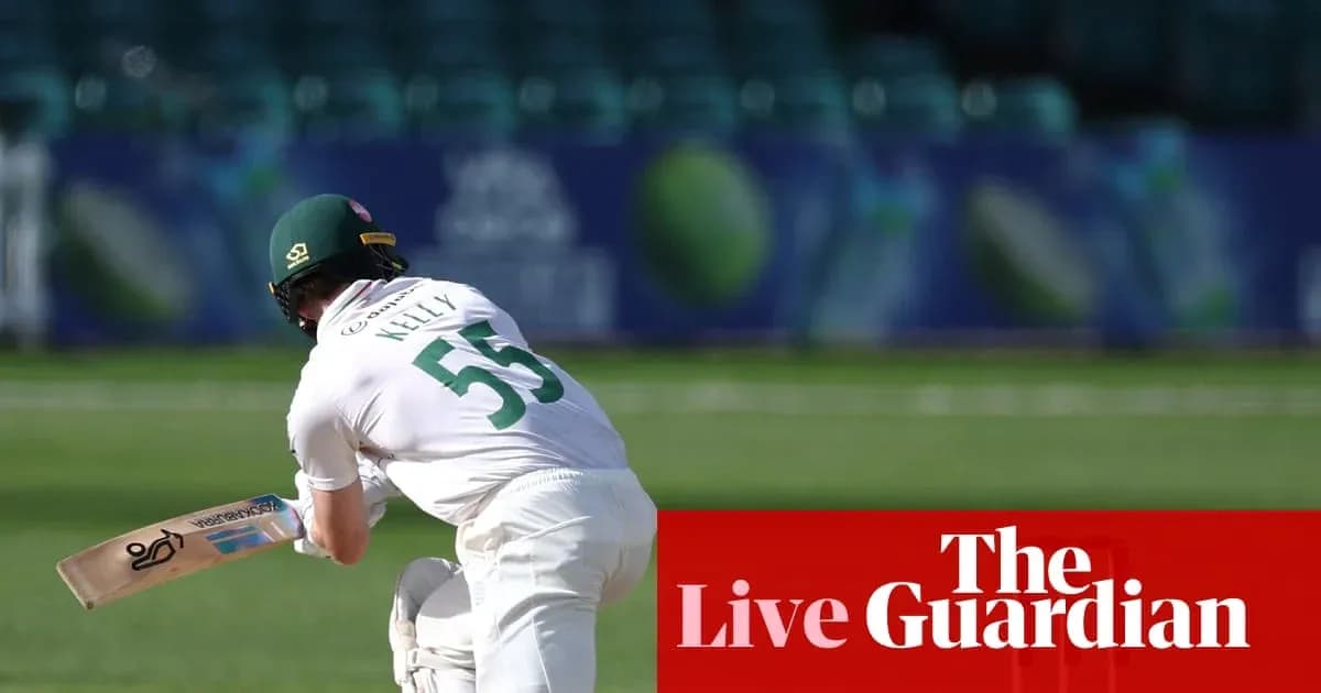 Batsman in white kit preparing to bat