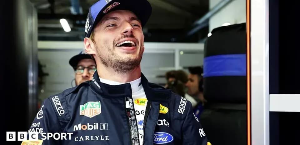 Driver smiling in the garage before race