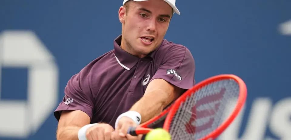 Player hitting a forehand during a tennis match