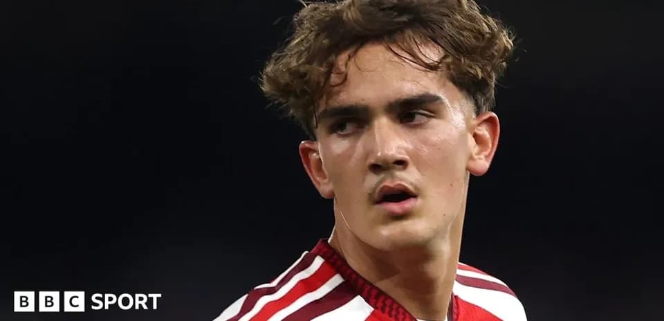 Young player in red kit during match