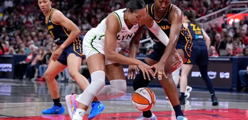 Players battling for the ball during basketball game