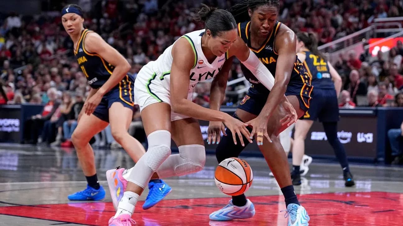Players battling for the ball during basketball game