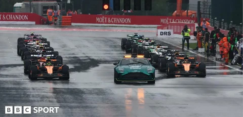 Cars lined up on track before wet race start