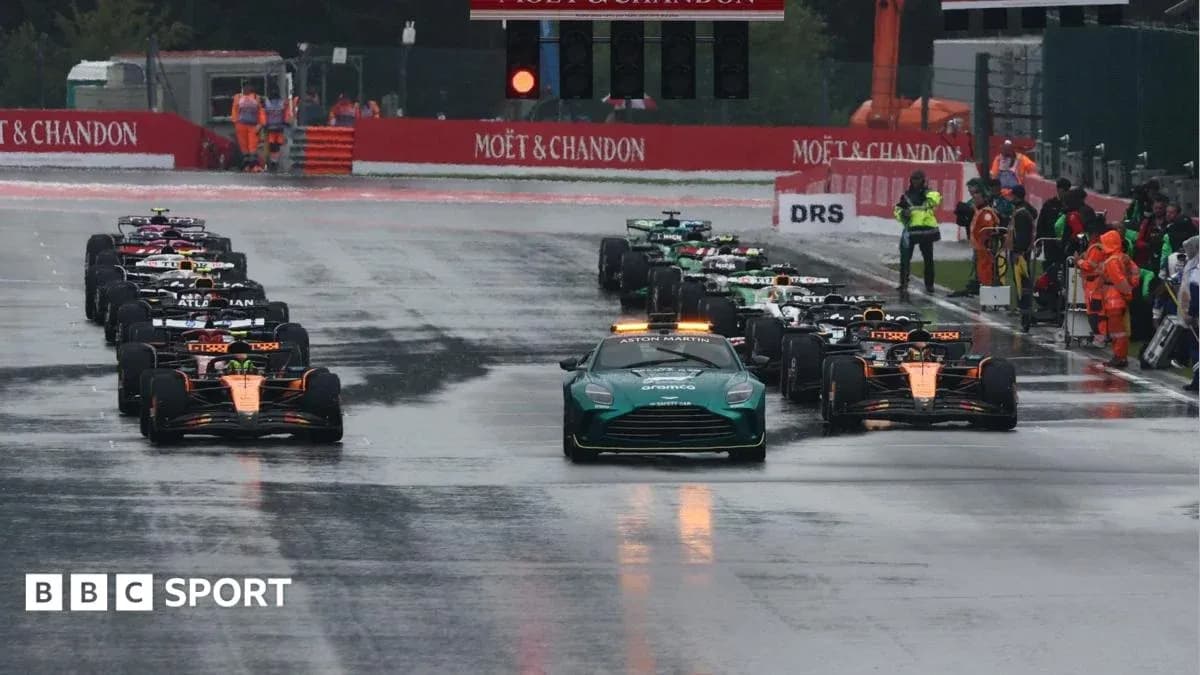 Cars lined up on track before wet race start