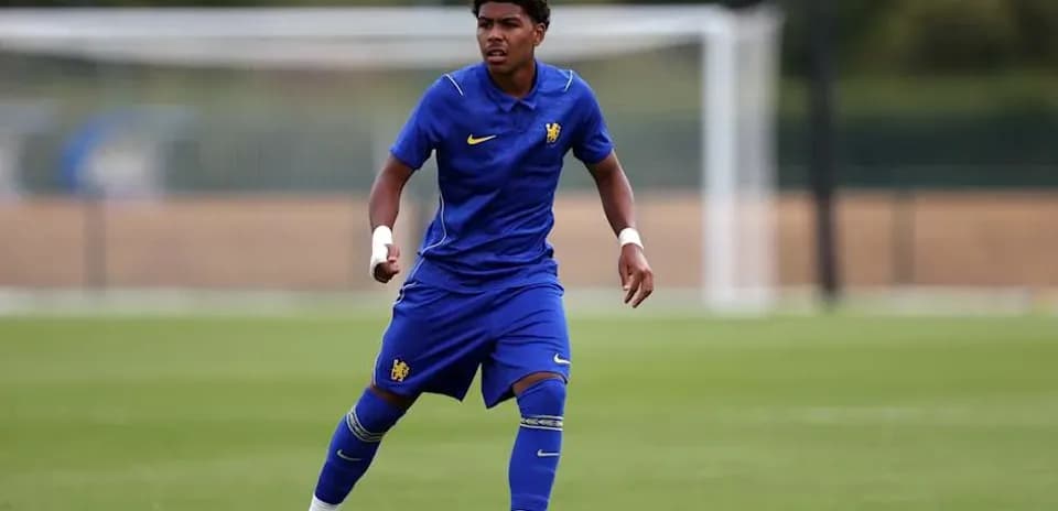 Player in blue kit training on football pitch