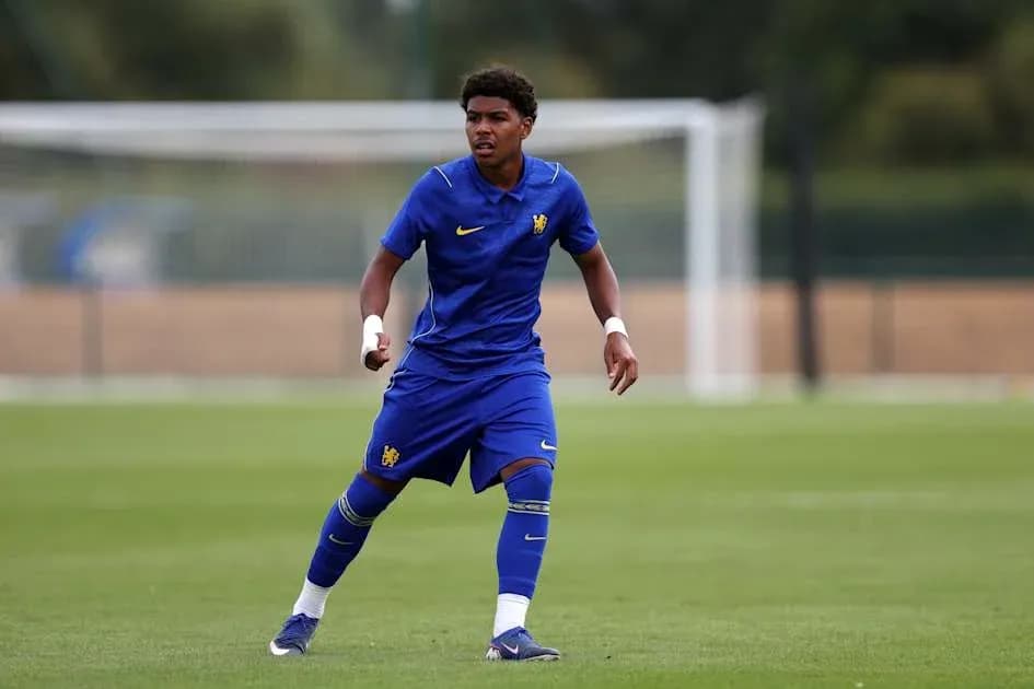 Player in blue kit training on football pitch