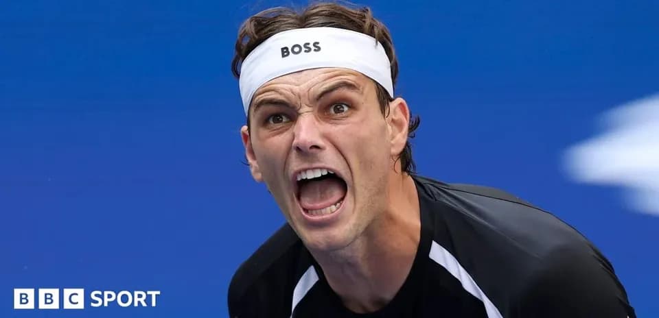 Tennis player celebrating with intense expression