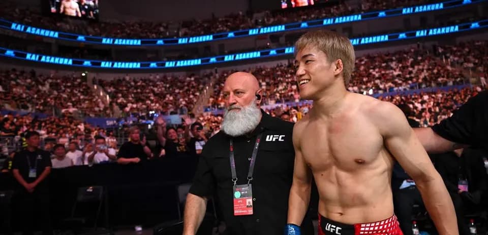 Fighter walking to the octagon with coach