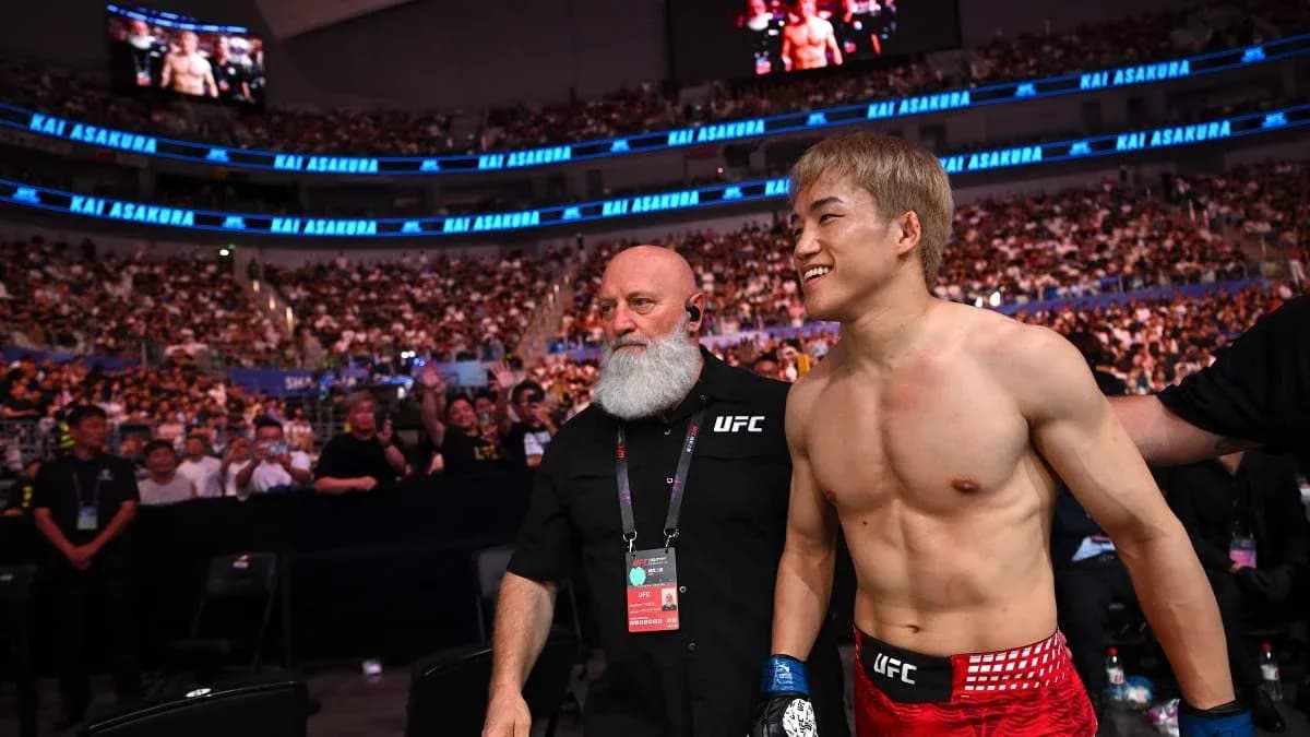 Fighter walking to the octagon with coach