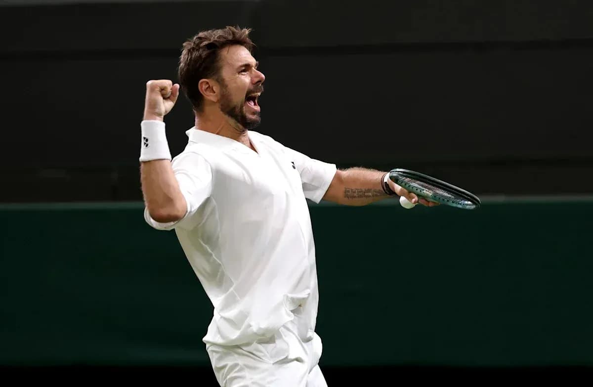 Tennis player celebrating victory with raised fist