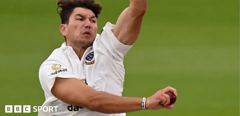 Bowler delivering a ball during cricket match