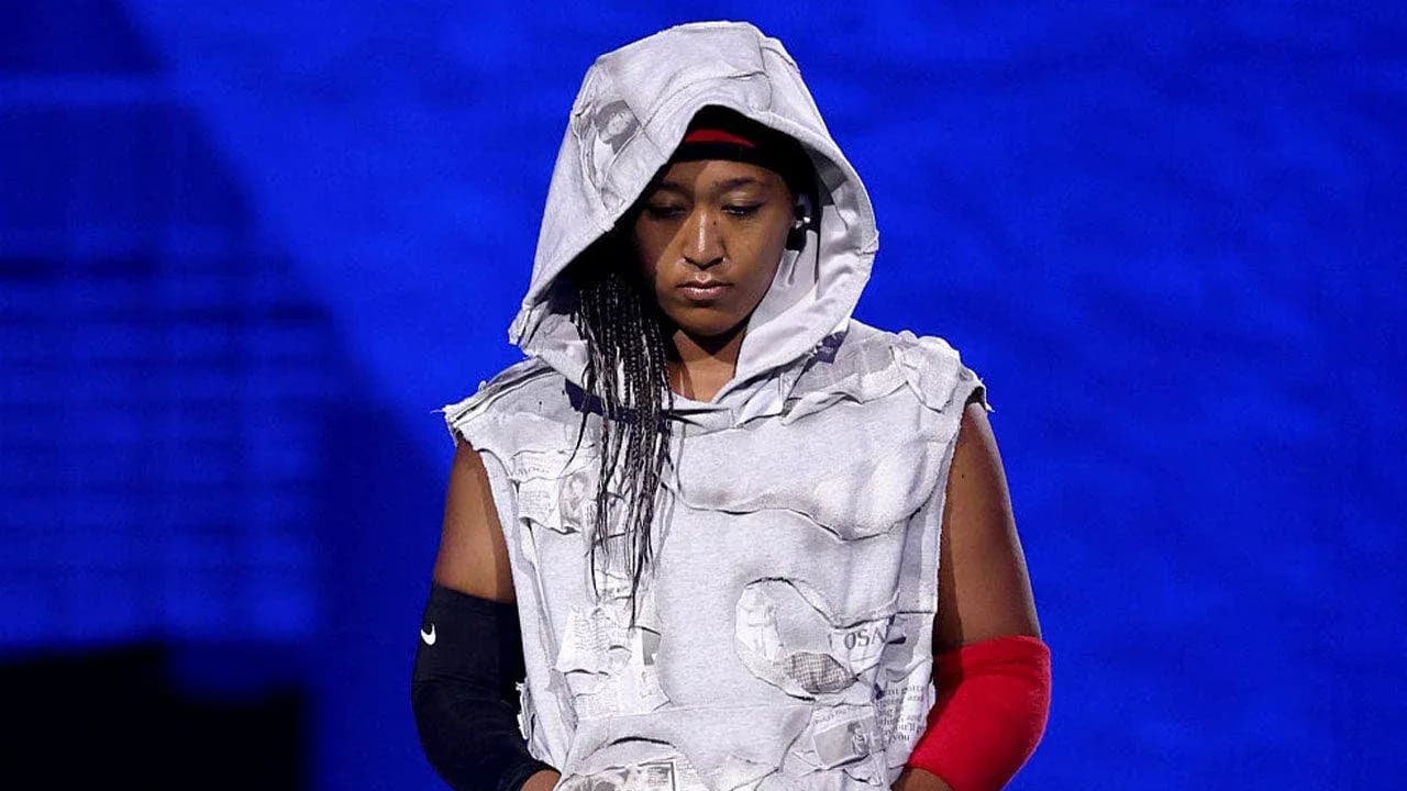 Athlete wearing a hooded outfit on stage