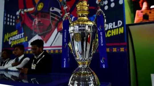Trophy displayed at cricket event with background mural