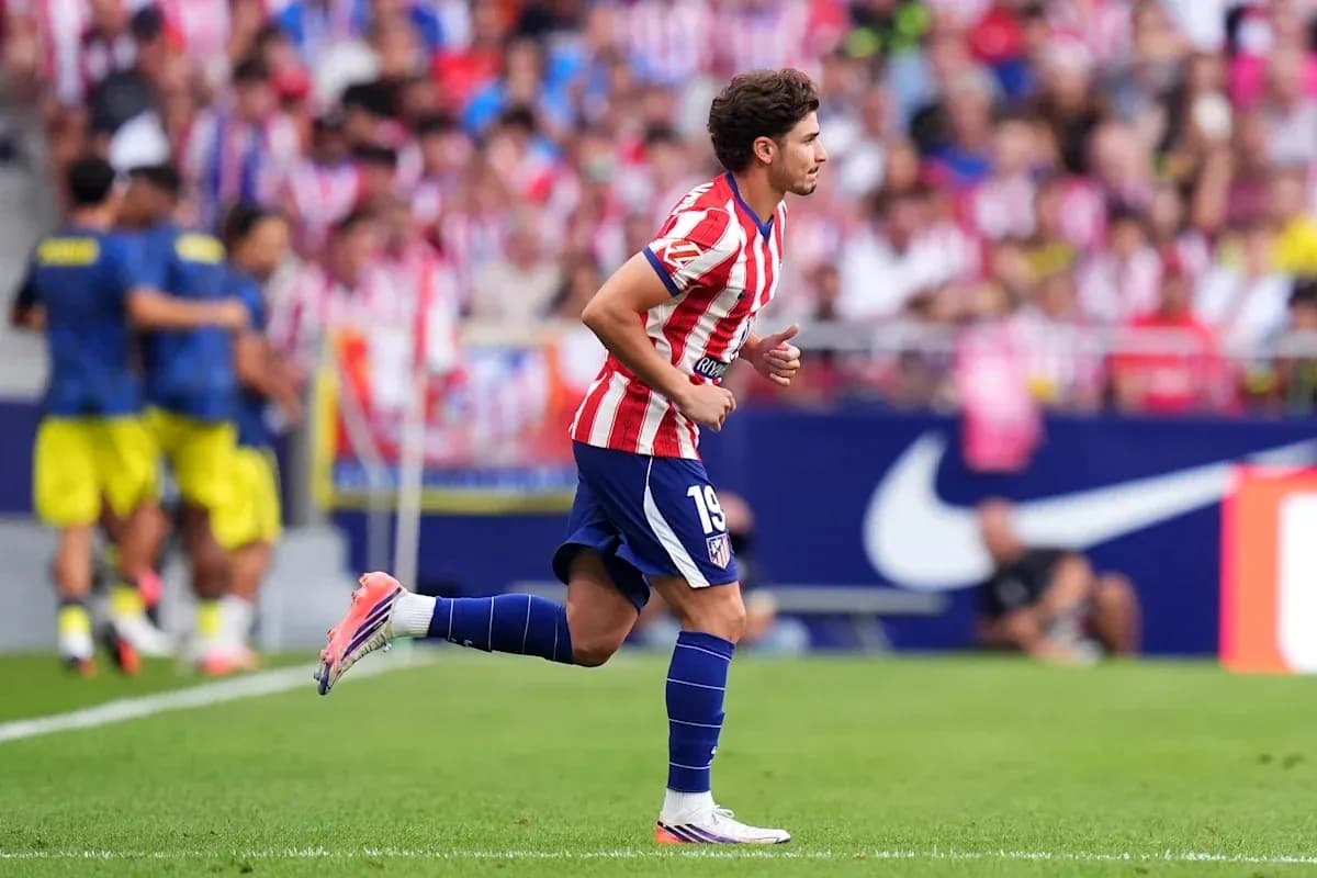 Atletico Madrid player running on the pitch