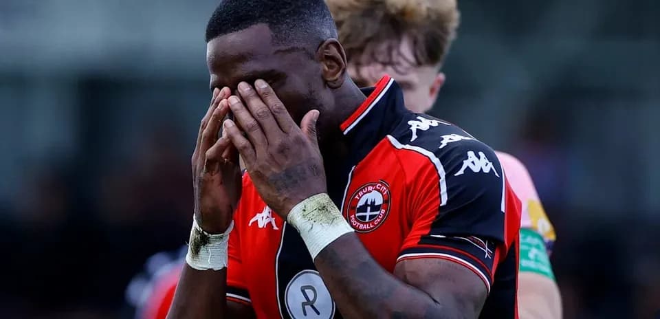 Player with hands on face in distress during match
