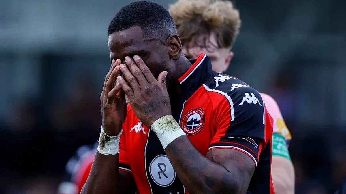 Player with hands on face in distress during match