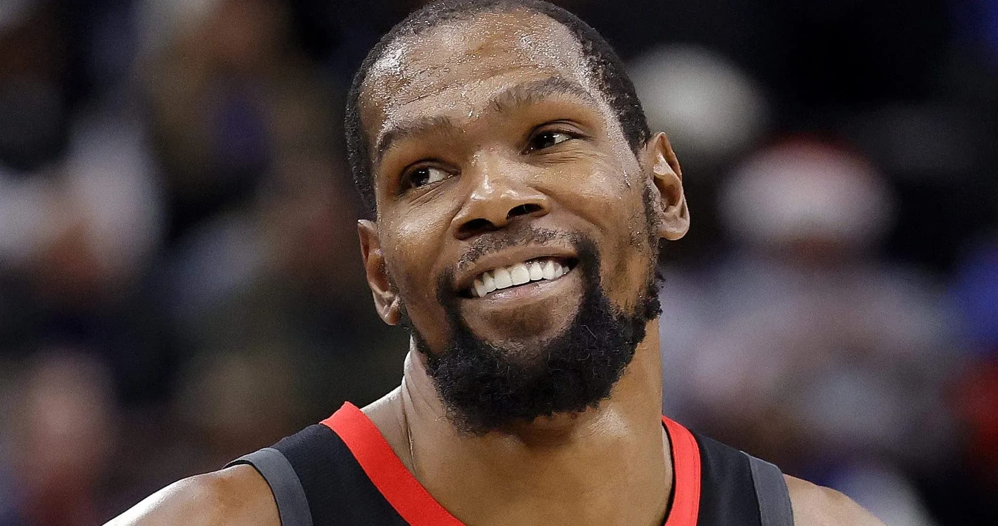 Kevin Durant smiling during a basketball game