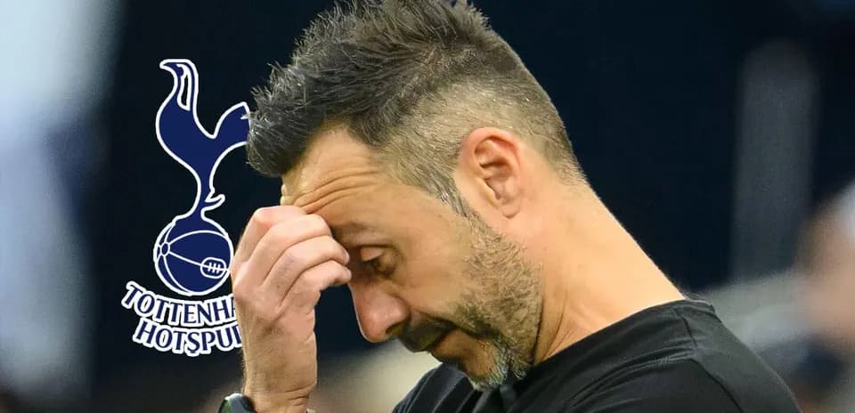 Coach holding head in frustration during match
