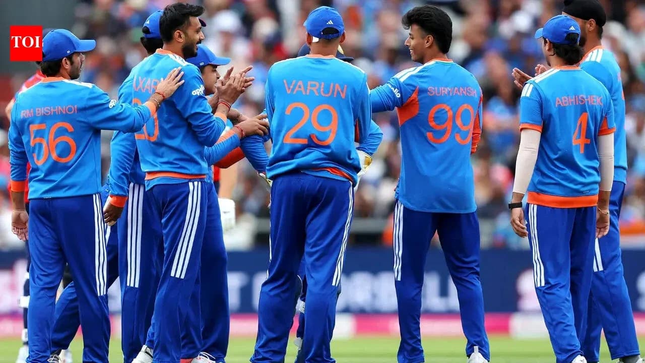Cricket team celebrating a wicket on field