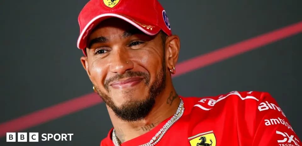 Driver in red Ferrari cap at press conference