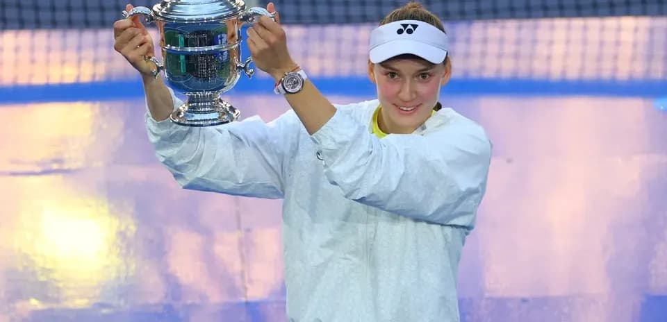 Player celebrating with trophy after match victory