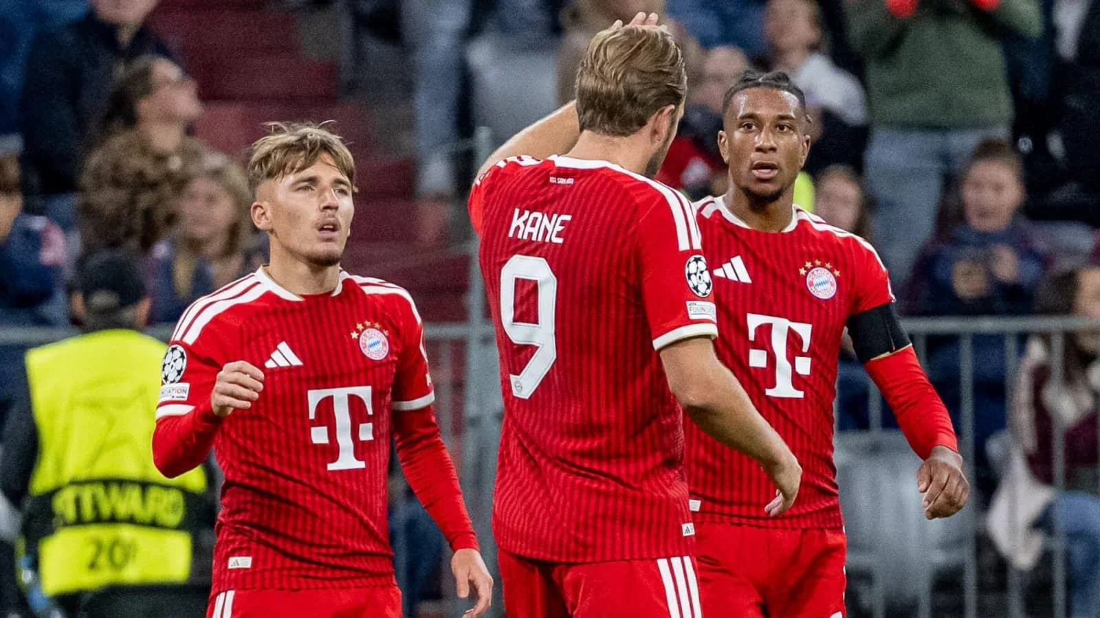 Bayern Munich players discussing on the field