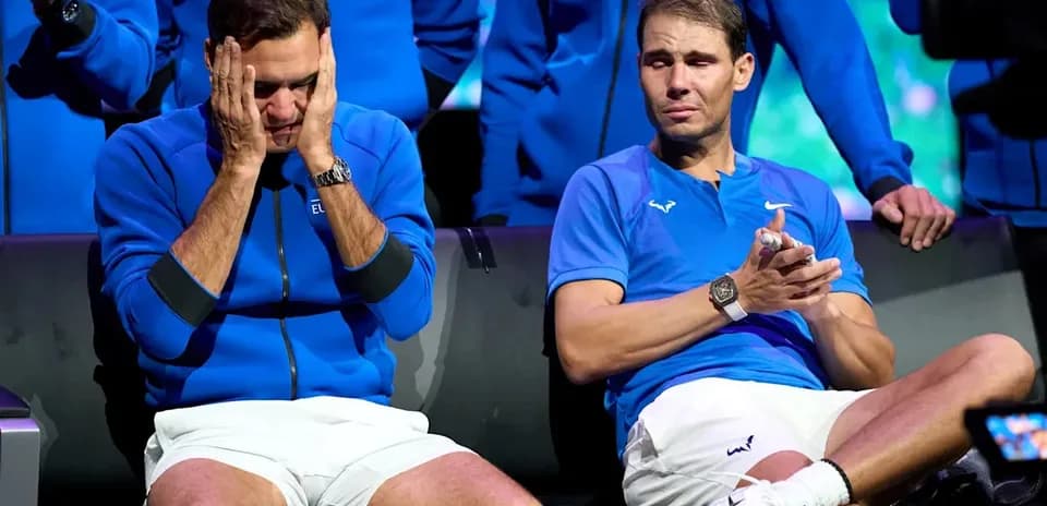 Roger Federer and Rafael Nadal seated together, looking emotional