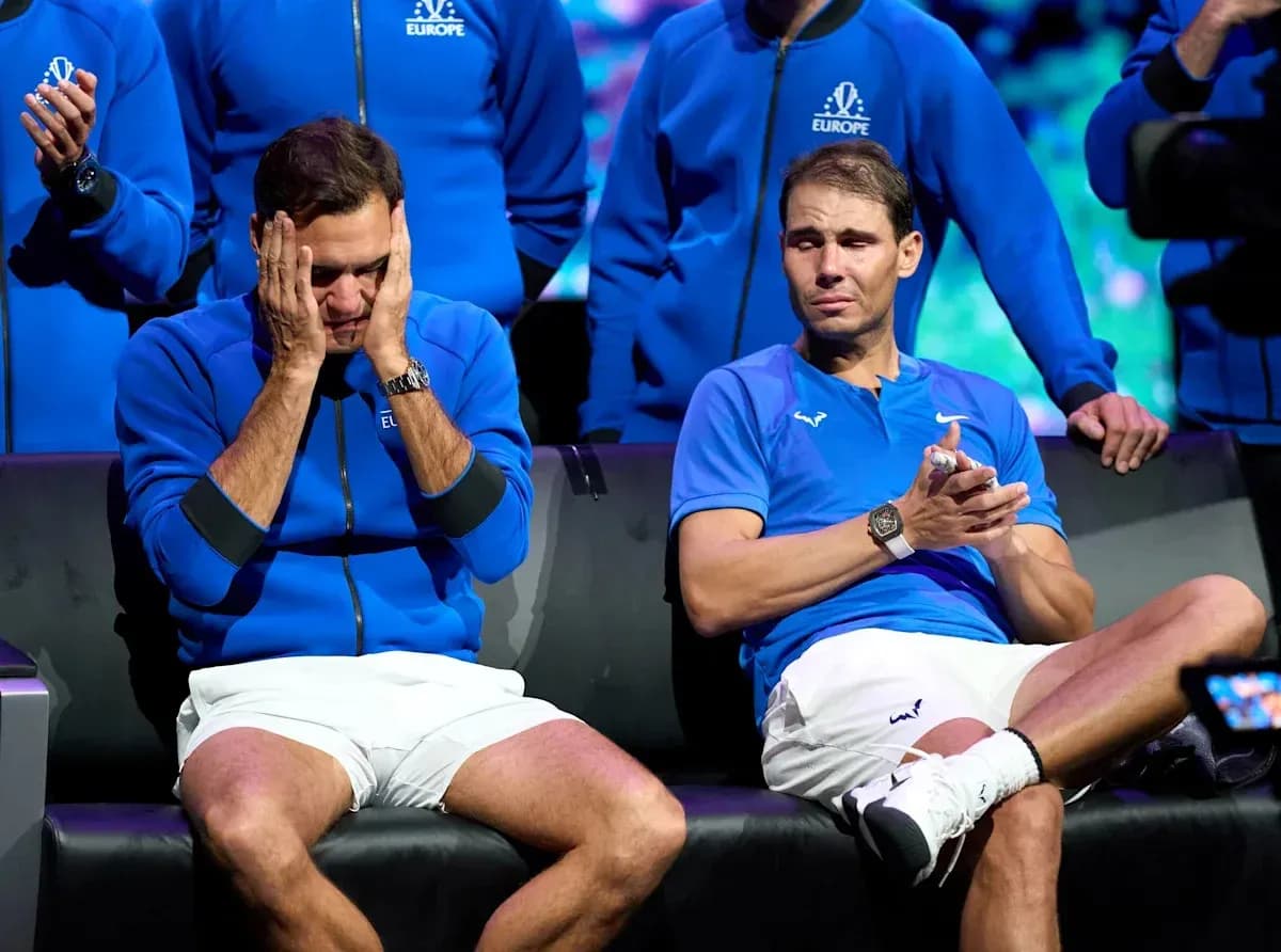 Roger Federer and Rafael Nadal seated together, looking emotional
