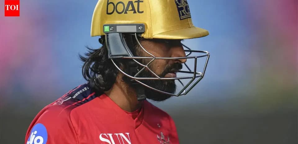 Cricketer wearing a golden helmet during match