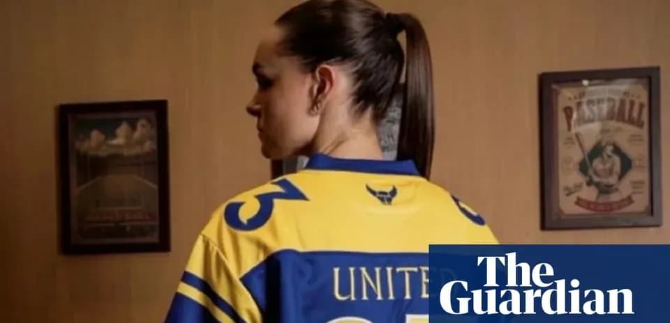 Person wearing a sports jersey with 'UNITED' text