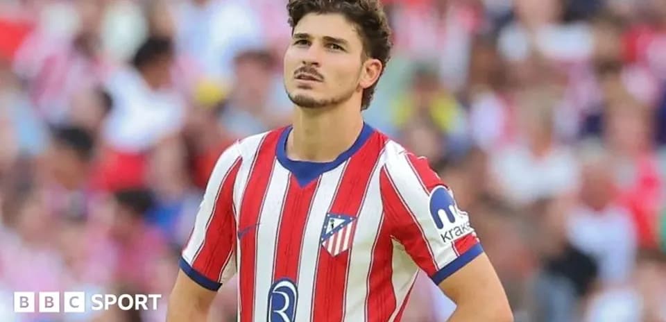 Player in Atlético Madrid jersey during match