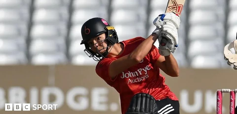 Batter striking the ball during cricket match