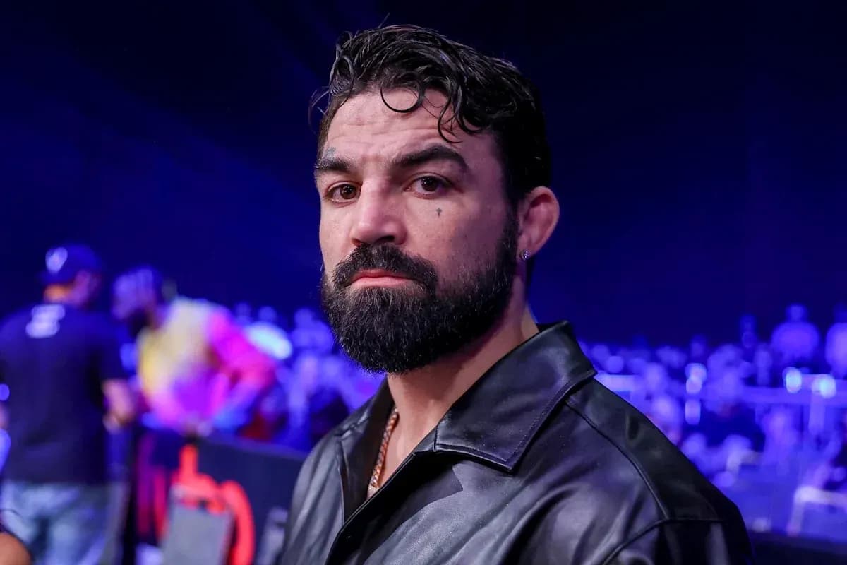 Man with beard and leather jacket at event