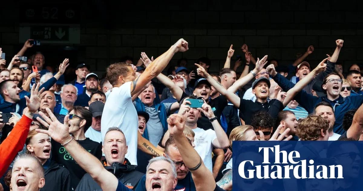 Crowd of enthusiastic fans cheering at event