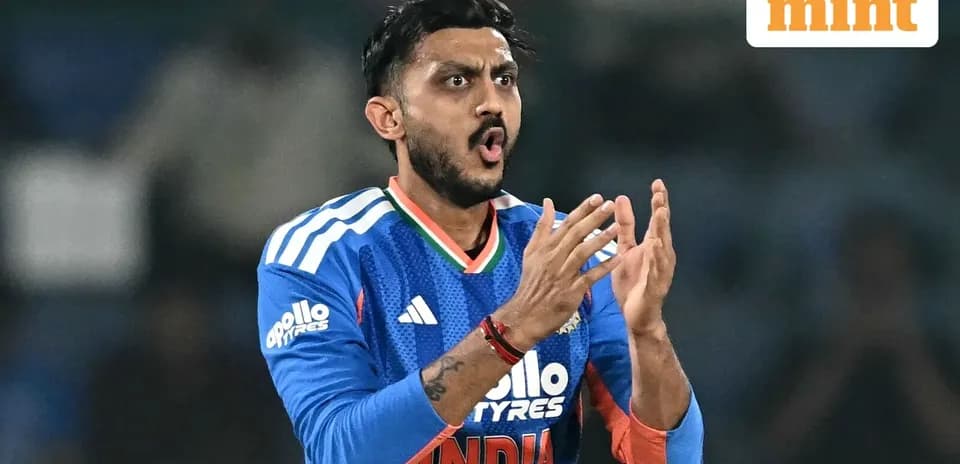 Cricketer celebrating during a match in blue uniform