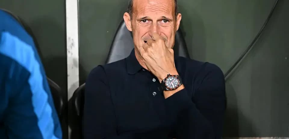 Coach sitting on the bench during a match