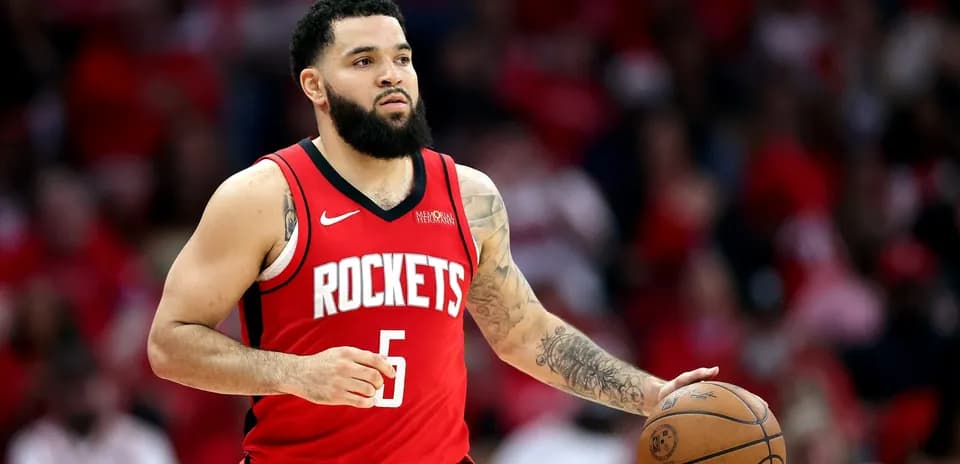 Player dribbling basketball during game for Rockets