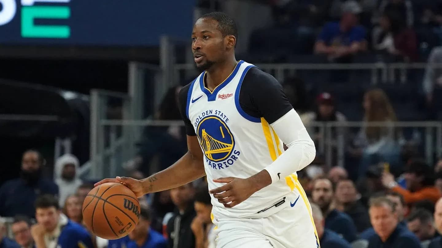 Player dribbling basketball during game for Warriors