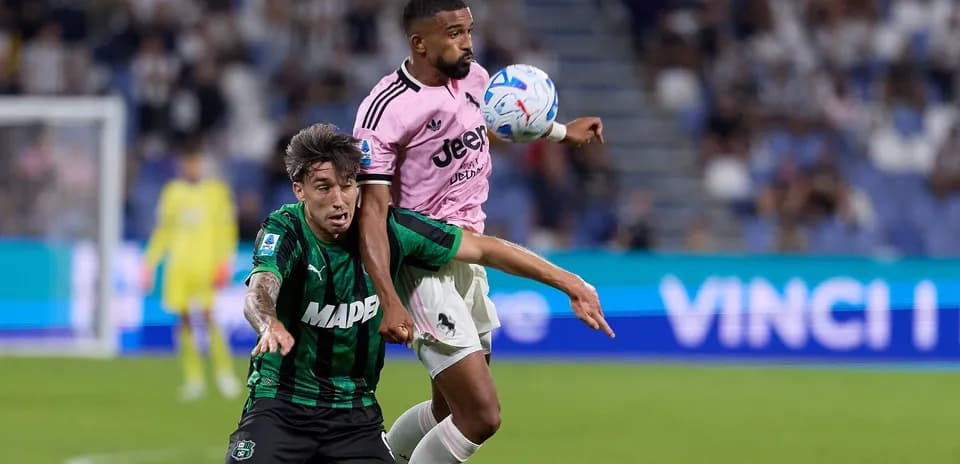 Two players contesting the ball during match action