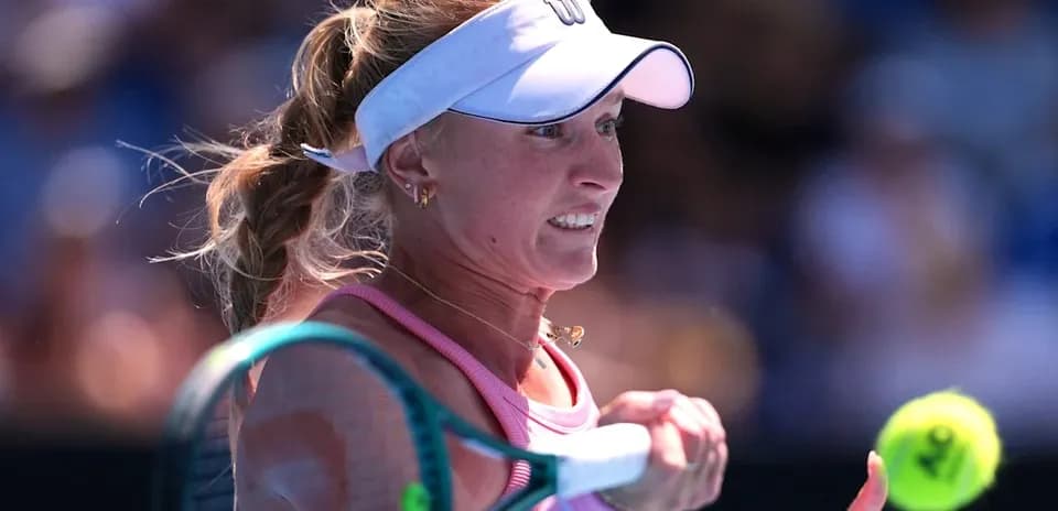 Female tennis player preparing to hit the ball