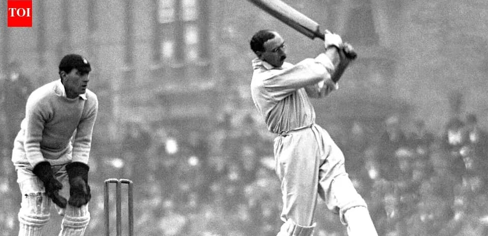 Batsman striking ball with bat, wicketkeeper behind